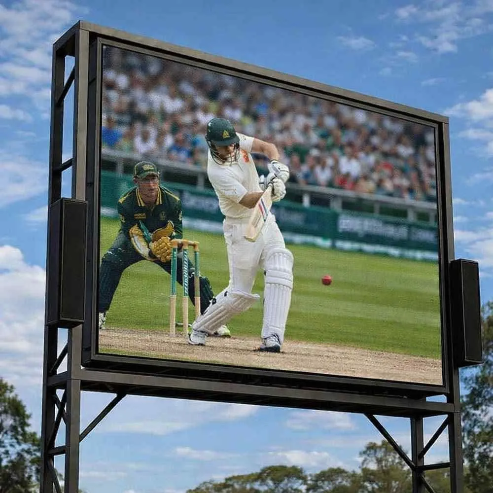 A 5m-wide outdoor cinema-grade LED screen on an engineered frame at dusk with a crowd