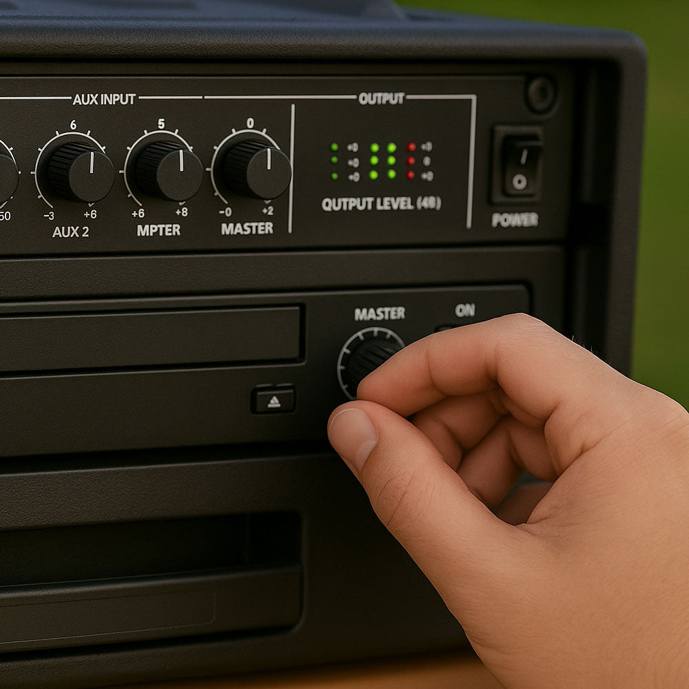 Hand adjusting a knob on an audio mixer equipment control panel with a blurred green background